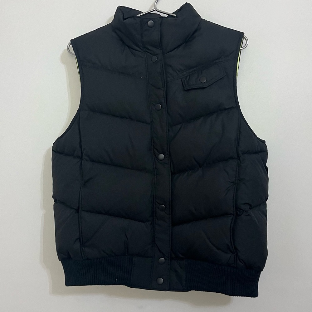 Black Puffer Vest by Gap is in like new condition. Size large.